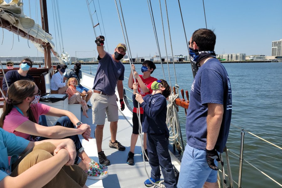 South Carolina Aquarium members help sailors on the Schooner Pride during a member event