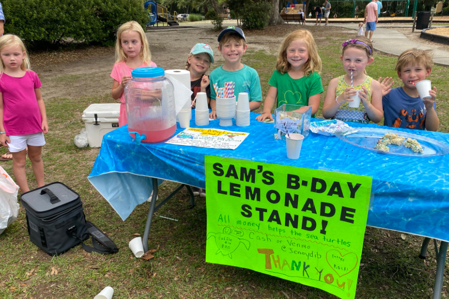 kids run a lemonade stand for as a birthday fundraiser to support the South Carolina Aquarium