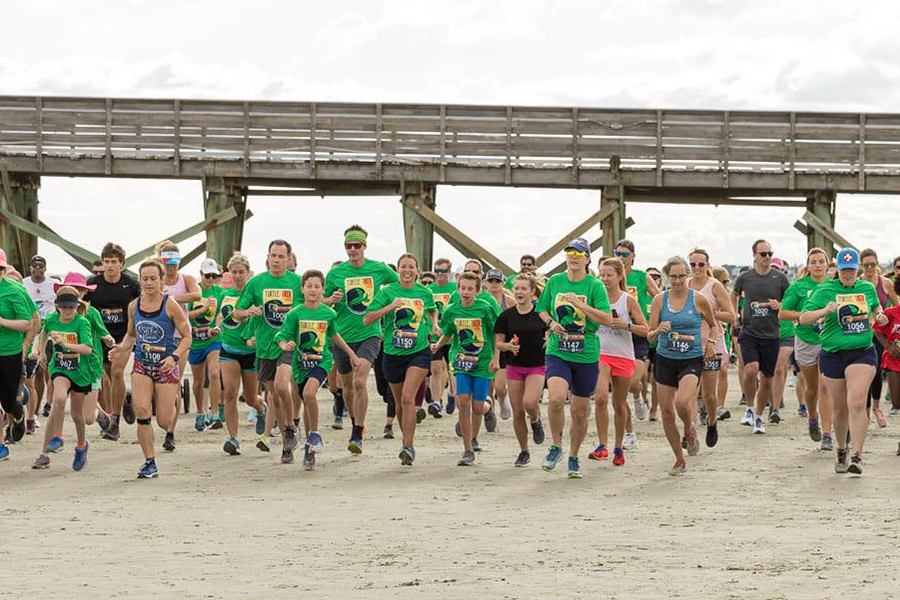 runners participate in the 2021 South Carolina Aquarium Turtle Trek 5k on Isle of Palms beach